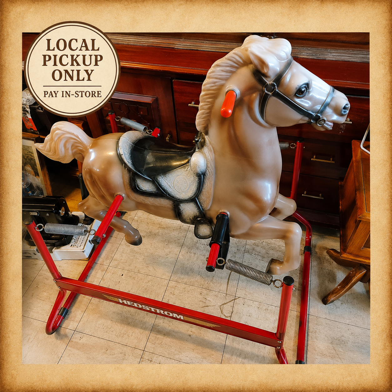 Vintage Hedstrom spring rocking horse with red metal frame, western-style saddle, and four suspension springs.