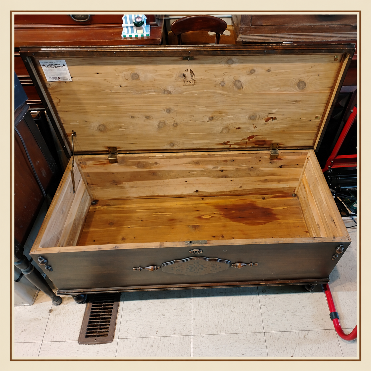Open vintage Lane cedar chest showing cedar-lined interior, original Lane markings, and Certified Moth Killer label.